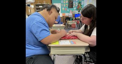 S-G students making a scarf